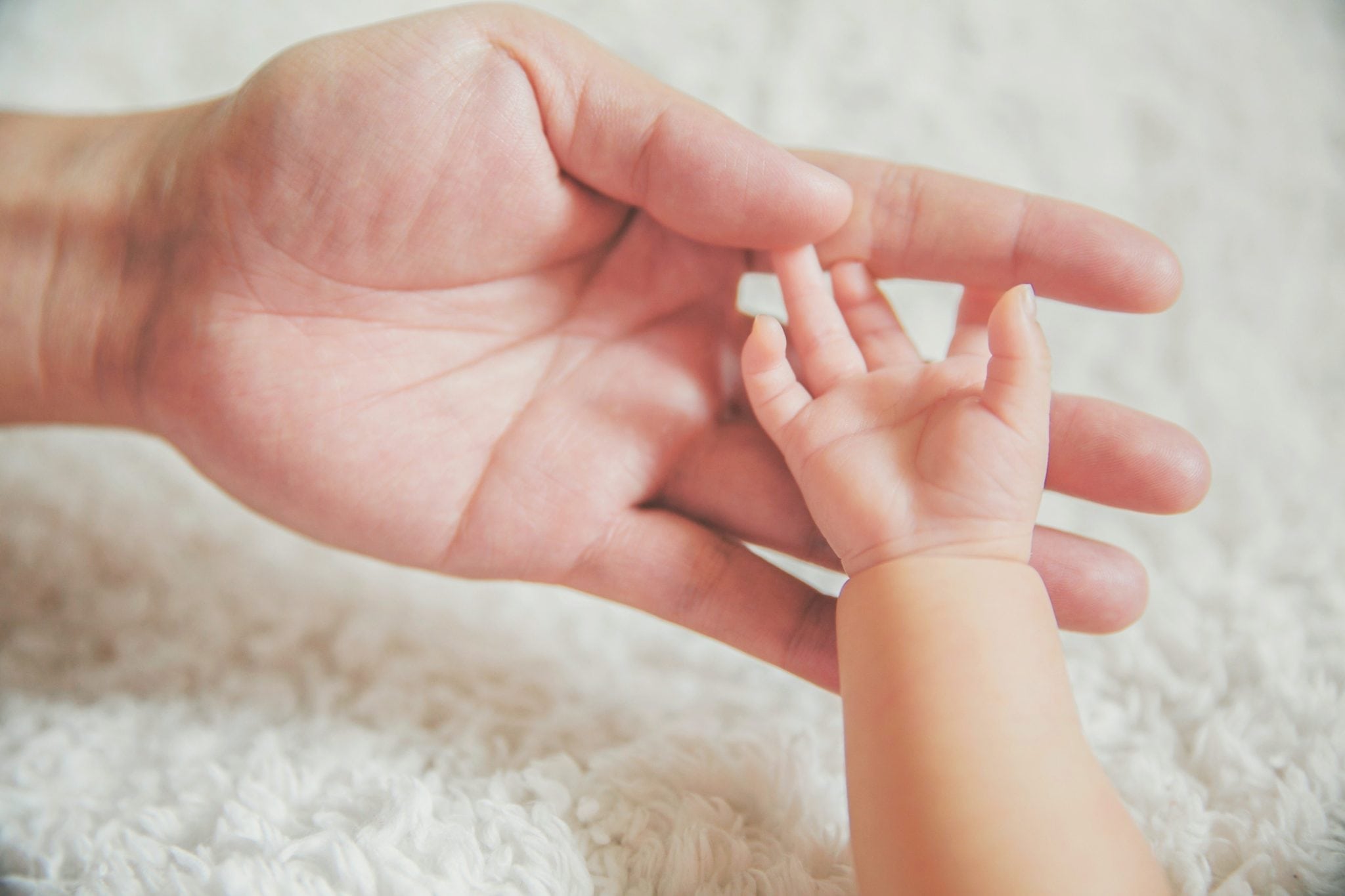 Baby and mom hands