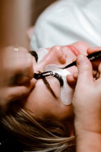 woman getting Eyelash Extensions 